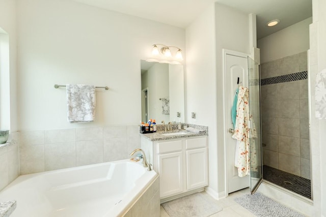 2337 Shalmar Dr, West Columbia, TX 77486 - bathroom with a garden tub, a stall shower, tile patterned flooring, and vanity