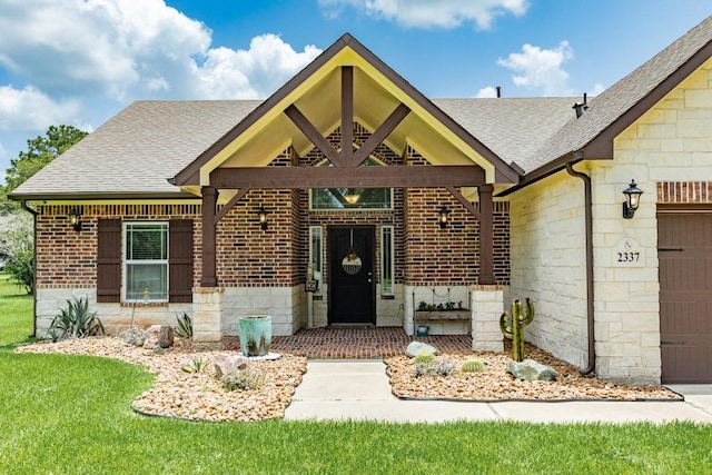 2337 Shalmar Dr, West Columbia, TX 77486 - view of front of property featuring roof with shingles, an attached garage, stone siding, brick siding, and a front yard