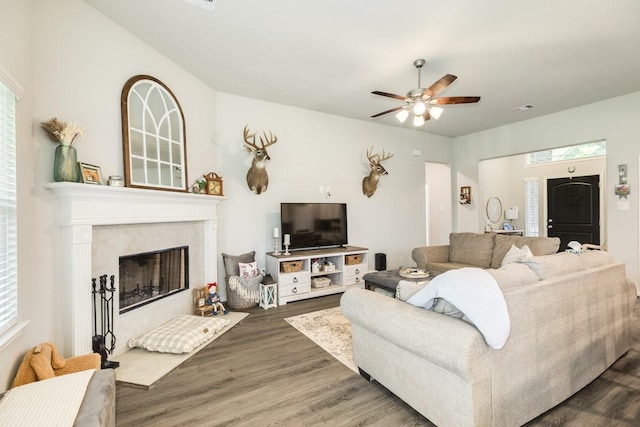 2337 Shalmar Dr, West Columbia, TX 77486 - living room with wood finished floors, a ceiling fan, and a tile fireplace