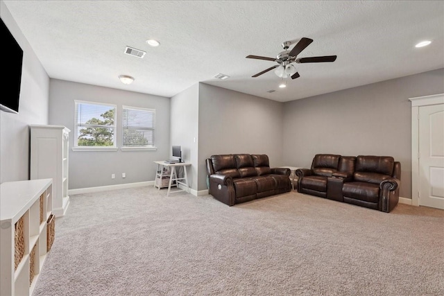 5219 Camp Creek Rd, Baytown, TX 77523 - living room with ceiling fan, carpet floors, a textured ceiling, and recessed lighting