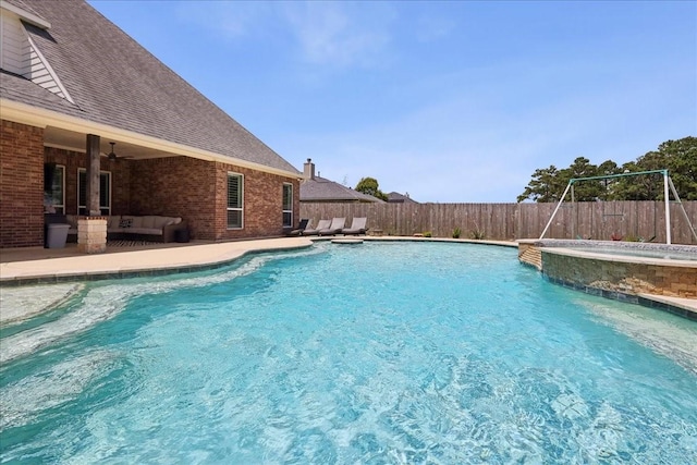 5219 Camp Creek Rd, Baytown, TX 77523 - view of pool with an outdoor hangout area, a fenced backyard, a pool with connected hot tub, and a ceiling fan