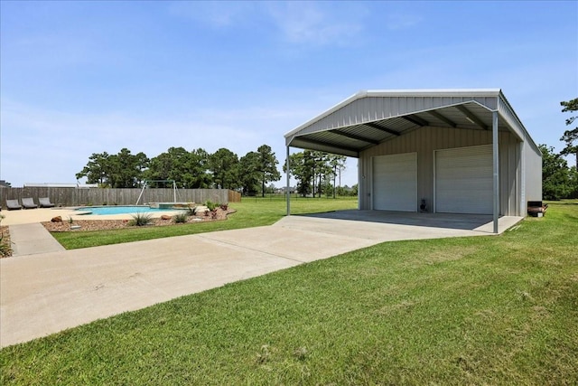 5219 Camp Creek Rd, Baytown, TX 77523 - view of yard featuring an outdoor structure and a detached garage