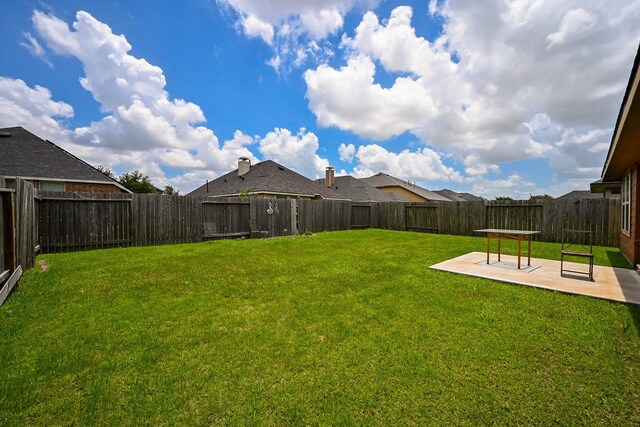 12207 Green City Ln, Houston, TX 77047 - fenced backyard featuring a patio area