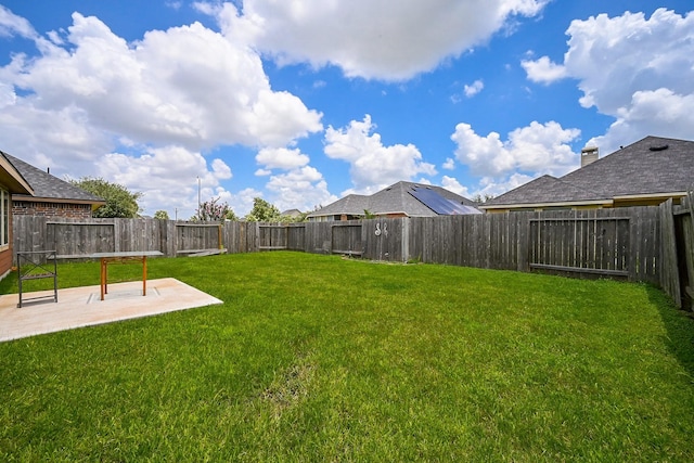 12207 Green City Ln, Houston, TX 77047 - fenced backyard featuring a patio area