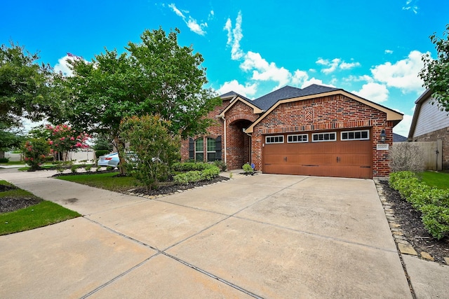 12207 Green City Ln, Houston, TX 77047 - view of front of house with brick siding, a garage, and concrete driveway