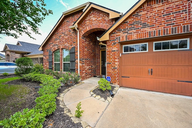 12207 Green City Ln, Houston, TX 77047 - view of front facade featuring brick siding, a garage, and driveway