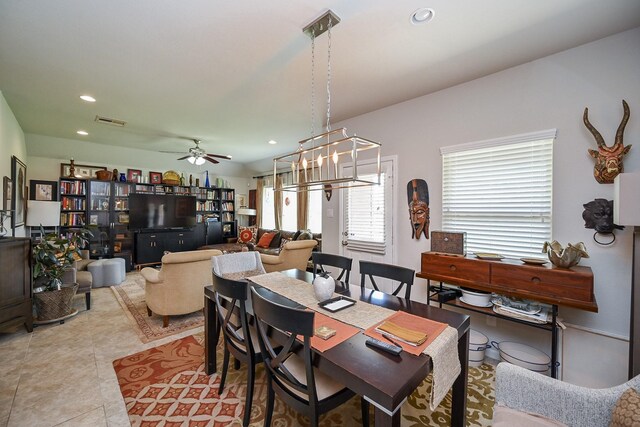 12207 Green City Ln, Houston, TX 77047 - tiled dining space with recessed lighting, a ceiling fan, and a chandelier