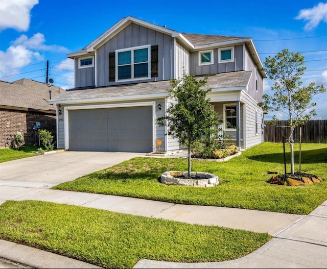 25706 Provender Pl, Katy, TX 77493 - traditional home with an attached garage, board and batten siding, and driveway