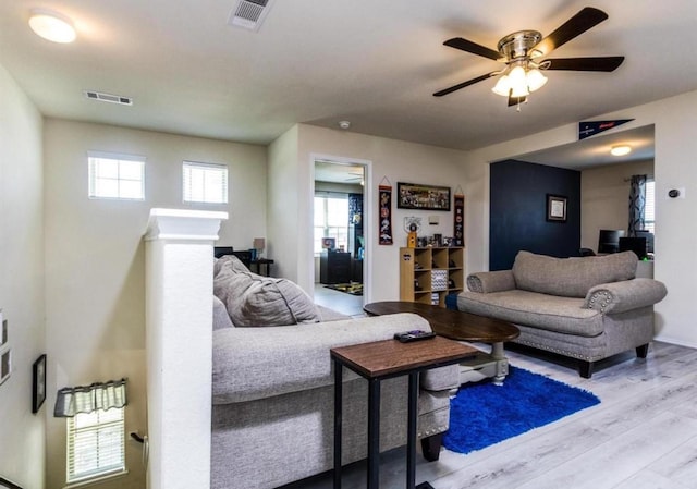 25706 Provender Pl, Katy, TX 77493 - living area featuring wood finished floors, ceiling fan, and healthy amount of natural light