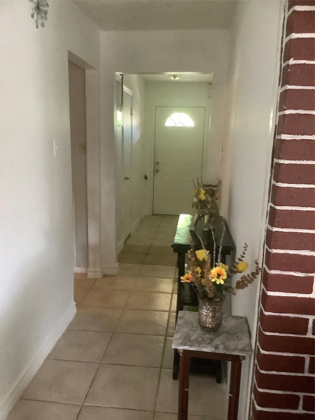 9406 Jolly Wood Ct, Houston, TX 77086 - corridor featuring light tile patterned flooring and baseboards