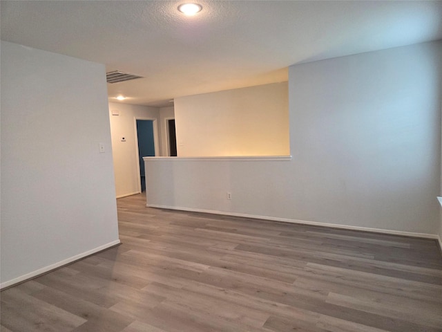 2703 Oakland Brook St, Houston, TX 77038 - unfurnished room with wood finished floors and baseboards