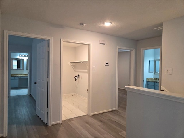 2703 Oakland Brook St, Houston, TX 77038 - corridor featuring dark wood-style flooring and recessed lighting