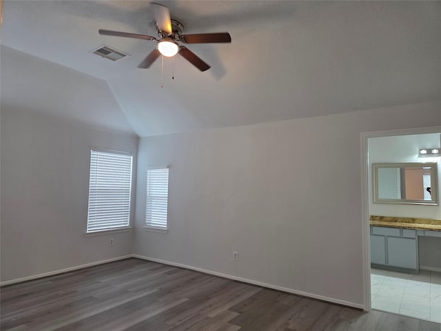 2703 Oakland Brook St, Houston, TX 77038 - empty room featuring a ceiling fan, vaulted ceiling, and light wood-type flooring