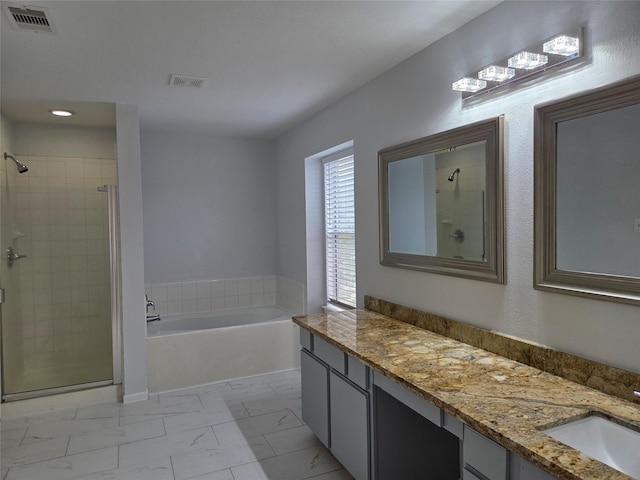 2703 Oakland Brook St, Houston, TX 77038 - full bathroom with a bath, a stall shower, vanity, marble finish floors, and recessed lighting