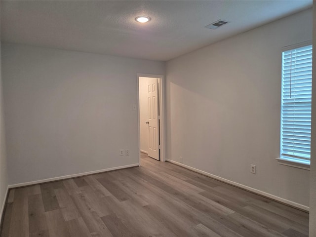 2703 Oakland Brook St, Houston, TX 77038 - unfurnished room with wood finished floors and recessed lighting
