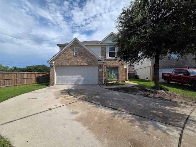 2703 Oakland Brook St, Houston, TX 77038 - traditional-style home with driveway, brick siding, and a garage