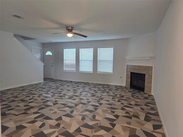 2703 Oakland Brook St, Houston, TX 77038 - unfurnished living room featuring ceiling fan and a tiled fireplace