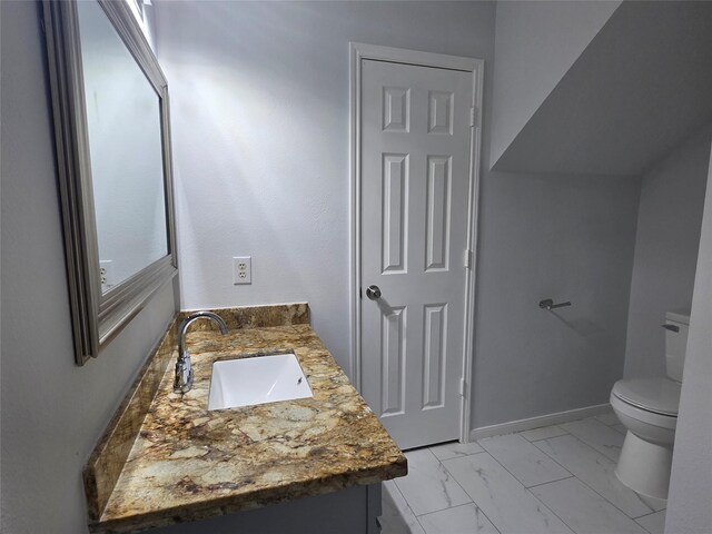 2703 Oakland Brook St, Houston, TX 77038 - bathroom featuring vanity and marble look tiles