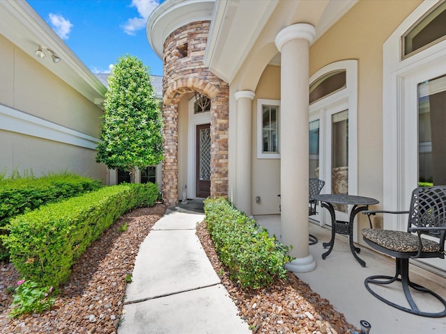 6922 Carolina Cherry Ln, Spring, TX 77389 - doorway to property with stone siding and stucco siding