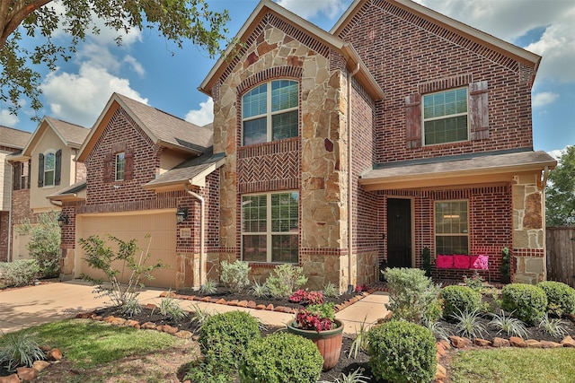 27619 Dalton Bluff Ct, Katy, TX 77494 - view of front of home featuring stone siding, brick siding, driveway, and a garage