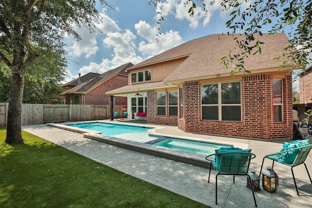 27619 Dalton Bluff Ct, Katy, TX 77494 - view of swimming pool with an in-ground hot tub, a fenced backyard, and a patio