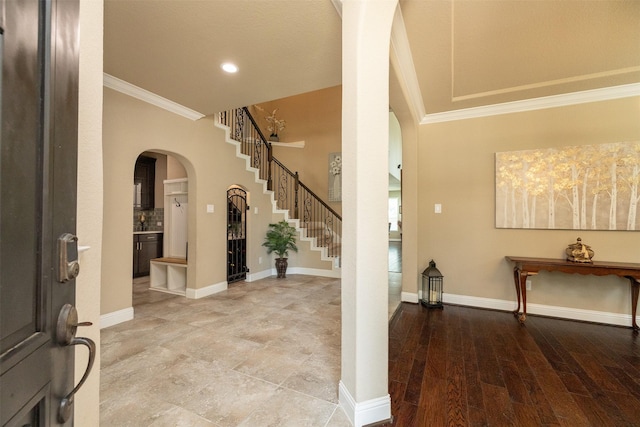 27619 Dalton Bluff Ct, Katy, TX 77494 - foyer entrance featuring arched walkways, crown molding, stairway, and recessed lighting