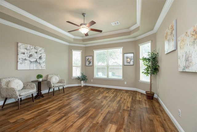 27619 Dalton Bluff Ct, Katy, TX 77494 - living area featuring a raised ceiling, wood finished floors, ceiling fan, and ornamental molding