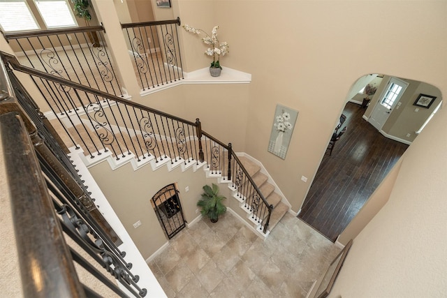 27619 Dalton Bluff Ct, Katy, TX 77494 - stairway with a towering ceiling, arched walkways, and plenty of natural light