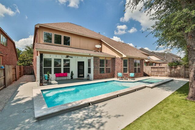 27619 Dalton Bluff Ct, Katy, TX 77494 - back of property with a fenced backyard, a patio, ceiling fan, and roof with shingles