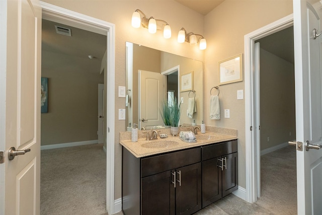 27619 Dalton Bluff Ct, Katy, TX 77494 - bathroom featuring double vanity and baseboards