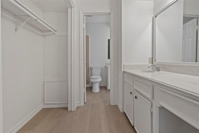 11011 Bandlon Dr, Houston, TX 77072 - bathroom featuring wood finished floors and vanity
