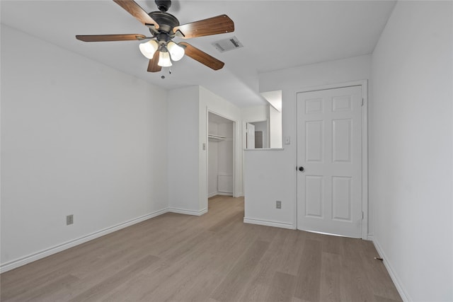11011 Bandlon Dr, Houston, TX 77072 - unfurnished bedroom with light wood-style flooring, a walk in closet, a closet, and ceiling fan