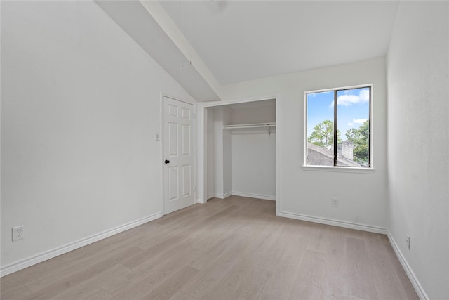 11011 Bandlon Dr, Houston, TX 77072 - unfurnished bedroom featuring light wood-style flooring, lofted ceiling, and a closet
