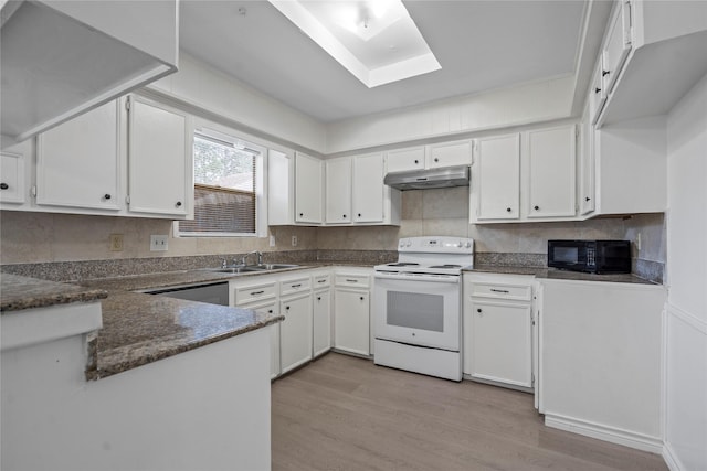 11011 Bandlon Dr, Houston, TX 77072 - kitchen with white electric stove, black microwave, light wood-type flooring, and under cabinet range hood