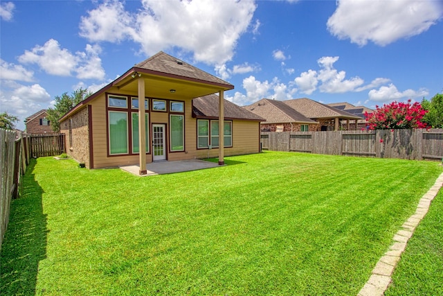 9427 Harmony Lake Ln, Richmond, TX 77469 - back of property with a patio area and a fenced backyard