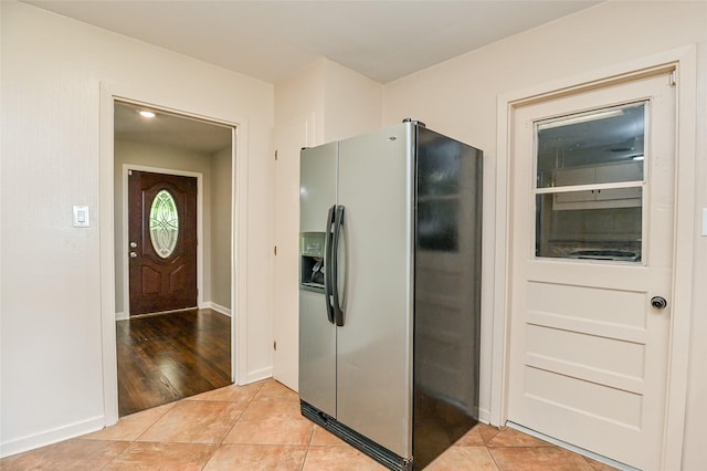 4502 Sanford Rd, Houston, TX 77035 - kitchen with stainless steel fridge and light tile patterned flooring