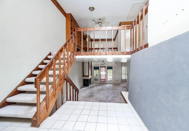 16160 Seahorse Dr, Houston, TX 77062 - stairway featuring a ceiling fan and carpet floors