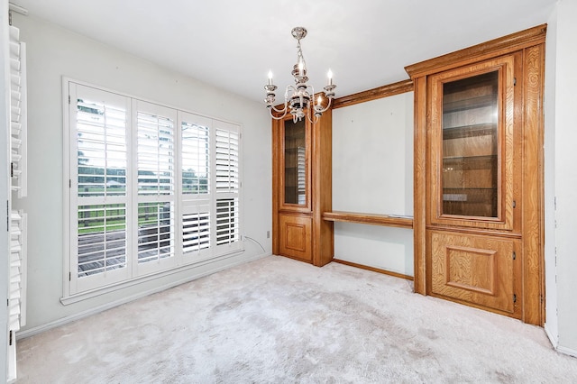 16160 Seahorse Dr, Houston, TX 77062 - empty room featuring a chandelier and carpet floors