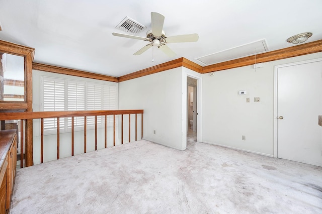 16160 Seahorse Dr, Houston, TX 77062 - carpeted spare room featuring attic access, a ceiling fan, and ornamental molding
