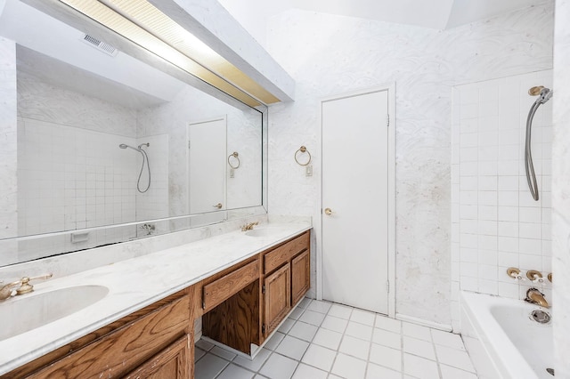 16160 Seahorse Dr, Houston, TX 77062 - bathroom with double vanity, tile patterned flooring, and tub / shower combination