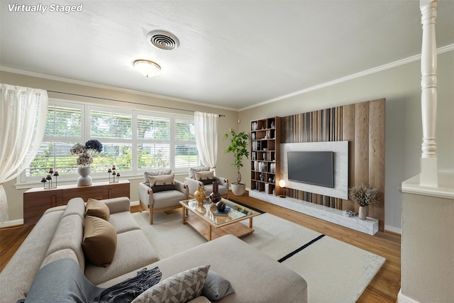 3014 Castlewood St, Houston, TX 77025 - living room featuring wood finished floors and crown molding