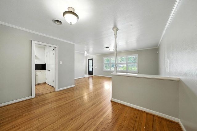 3014 Castlewood St, Houston, TX 77025 - unfurnished room with crown molding and light wood-style flooring