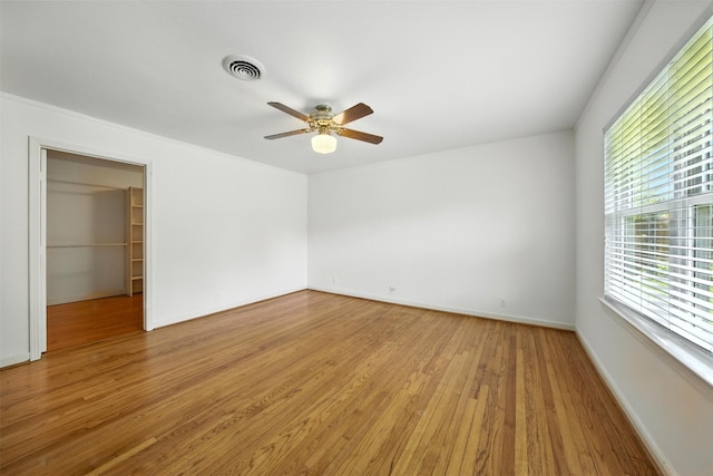 3014 Castlewood St, Houston, TX 77025 - unfurnished bedroom featuring light wood finished floors, a spacious closet, ceiling fan, and a closet