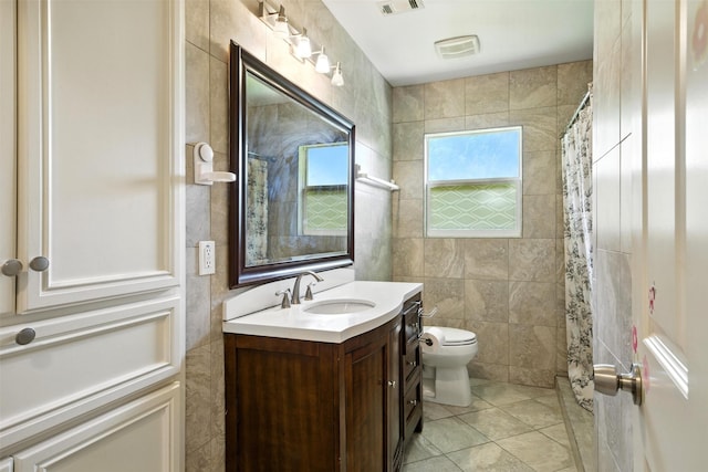 3014 Castlewood St, Houston, TX 77025 - bathroom with vanity, tile patterned flooring, a shower with curtain, and tile walls