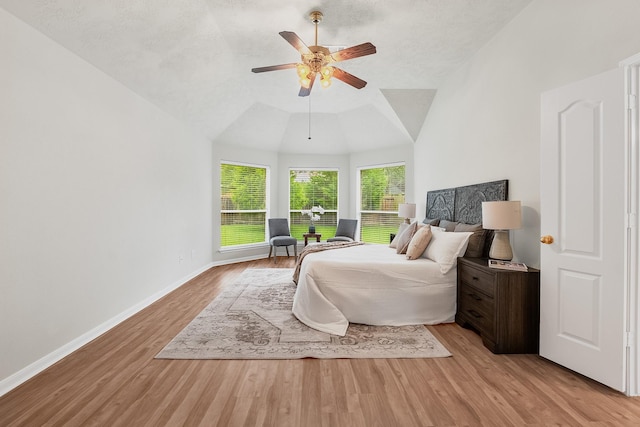15542 Stoneridge Park Ln, Cypress, TX 77429 - bedroom featuring light wood-style floors, a ceiling fan, and lofted ceiling