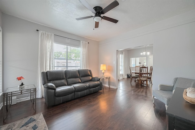 4401 Canal St, Houston, TX 77011 - living room with dark wood finished floors, ceiling fan, a textured ceiling, and a chandelier