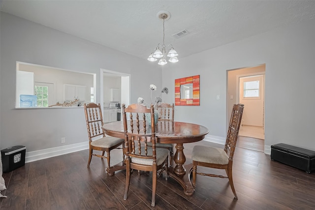 4401 Canal St, Houston, TX 77011 - dining room featuring healthy amount of natural light, dark wood-type flooring, and a chandelier