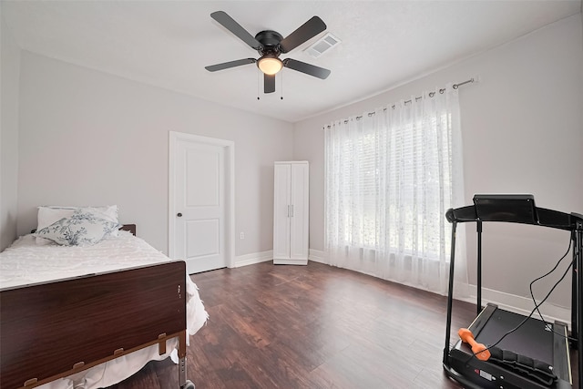 4401 Canal St, Houston, TX 77011 - bedroom with dark wood-style flooring and ceiling fan