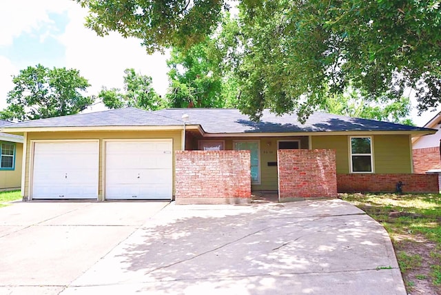 8606 S Friendship Rd, Houston, TX 77080 - ranch-style home with concrete driveway, a garage, and brick siding