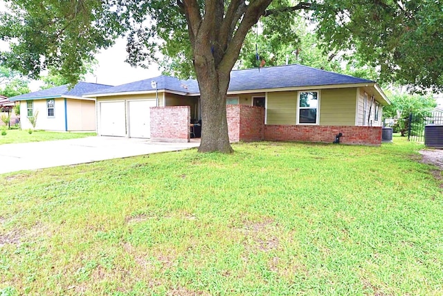8606 S Friendship Rd, Houston, TX 77080 - ranch-style house with a garage, concrete driveway, brick siding, and a front lawn